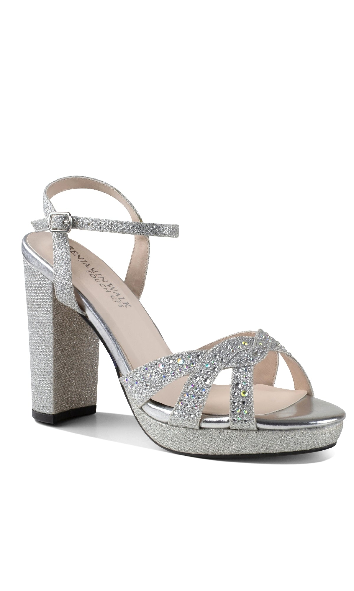 The Ava Silver Prom Shoes: Touch Ups 4633 feature a sparkly silver finish, ankle strap, crisscross toe straps, and a chic block heel—perfect high heels for any special occasion.